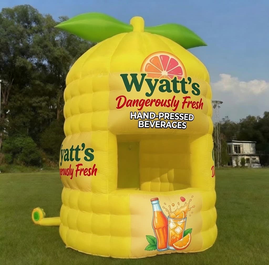 The 16-foot Dangerously Fresh inflatable lemon stand on a green field
